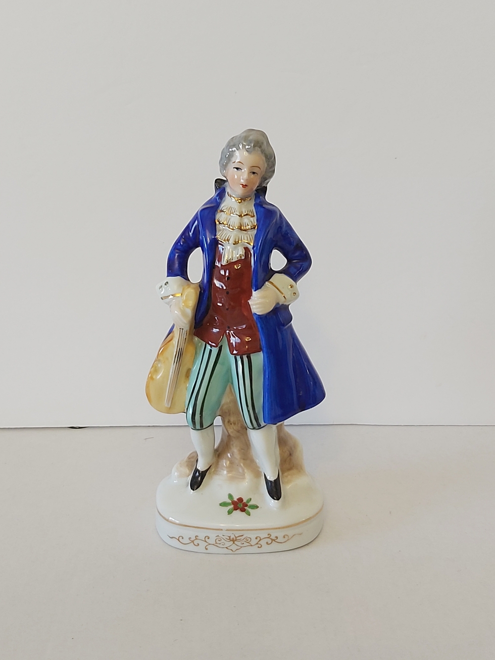 Porcelain Figurine in Blue Coat with Red Vest